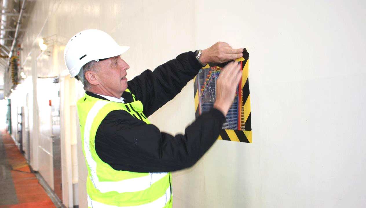 Image: Wightlink ferry crew member Dave Grace fixes a childrens' poster onboard flagship Victoria of Wight Image: Wightlink ferry crew member Dave Grace fixes a childrens' poster onboard flagship Victoria of Wight