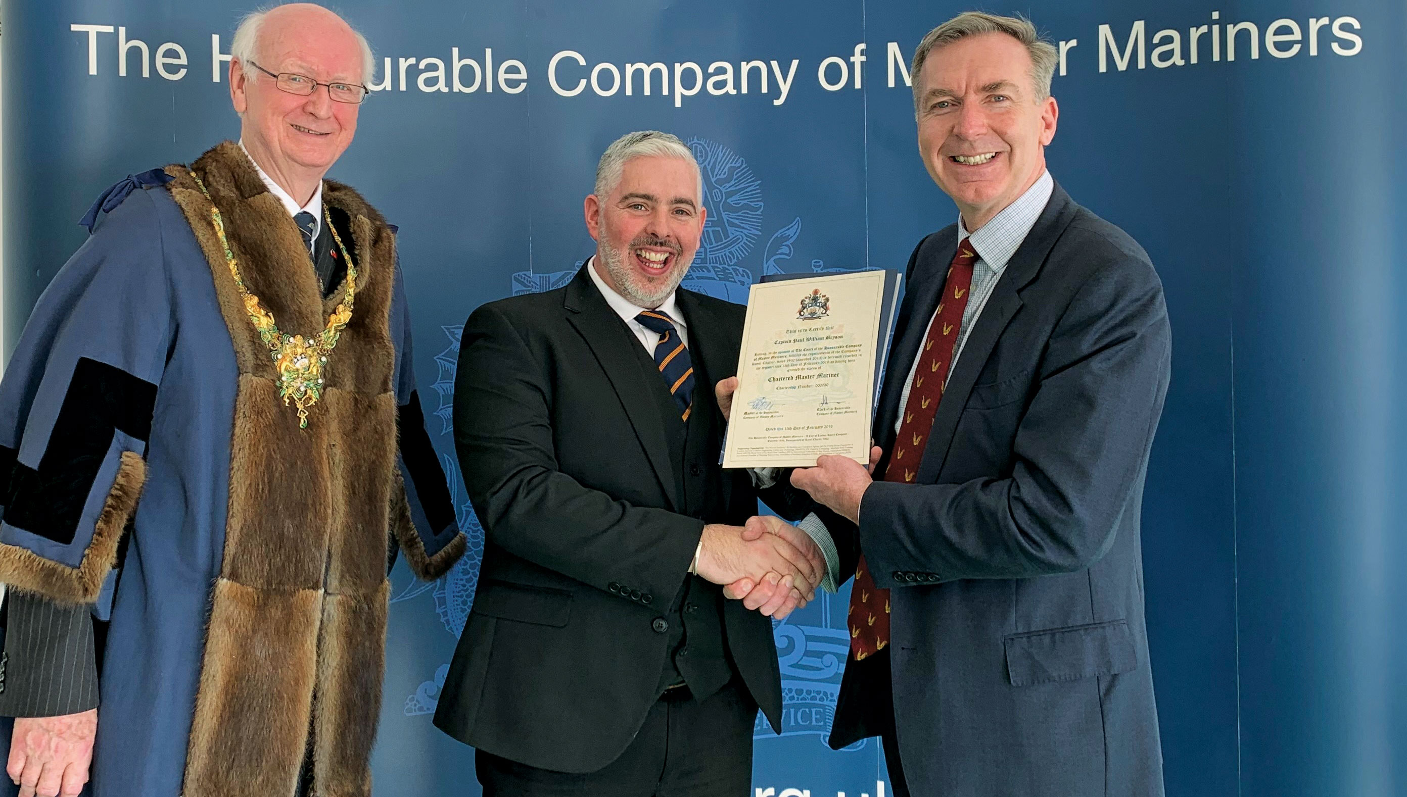 Captain Paul Bryson (centre) is among those awarded Chartered Master Mariner status Image:Captain Paul Bryson (centre) is among those awarded Chartered Master Mariner status